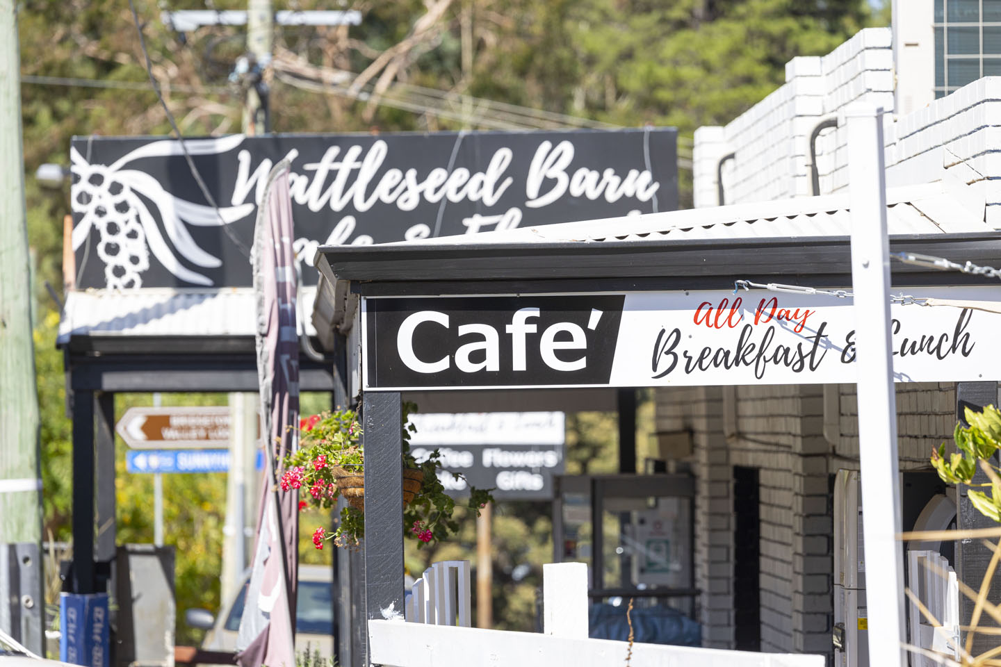 Street view of café signs and flowers