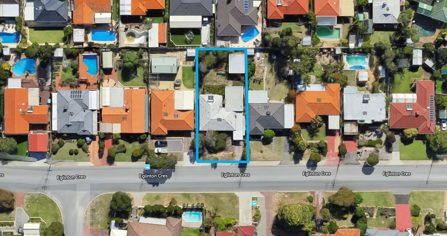 Aerial view of residential neighborhood with swimming pools.
