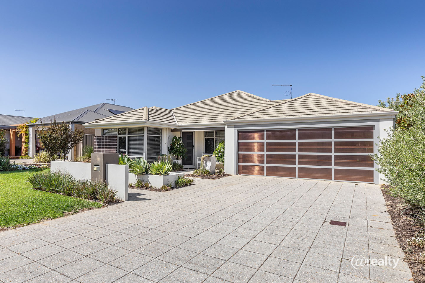 Modern suburban house with garage and garden